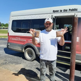 Driver at Pelivan Transit delivers donated pet food with meals to seniors. Driver at Pelivan Transit delivers donated pet food with meals to seniors.